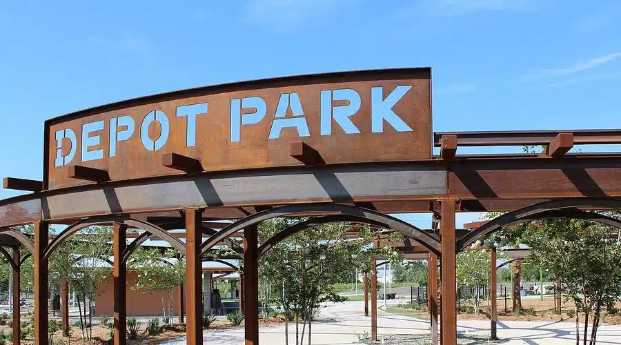 Depot Park entrance sign in Rio Linda, CA under clear blue sky