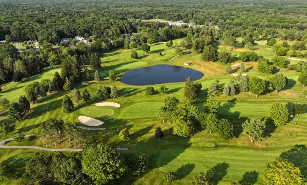 Aerial view of Lincoln Hills Golf Club surrounded by trees and residential areas