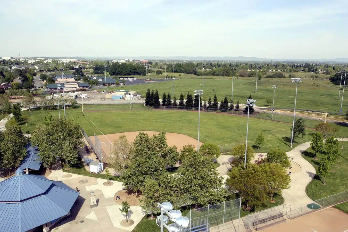 Howe Park open green field and splash pad in Arden Arcade, CA