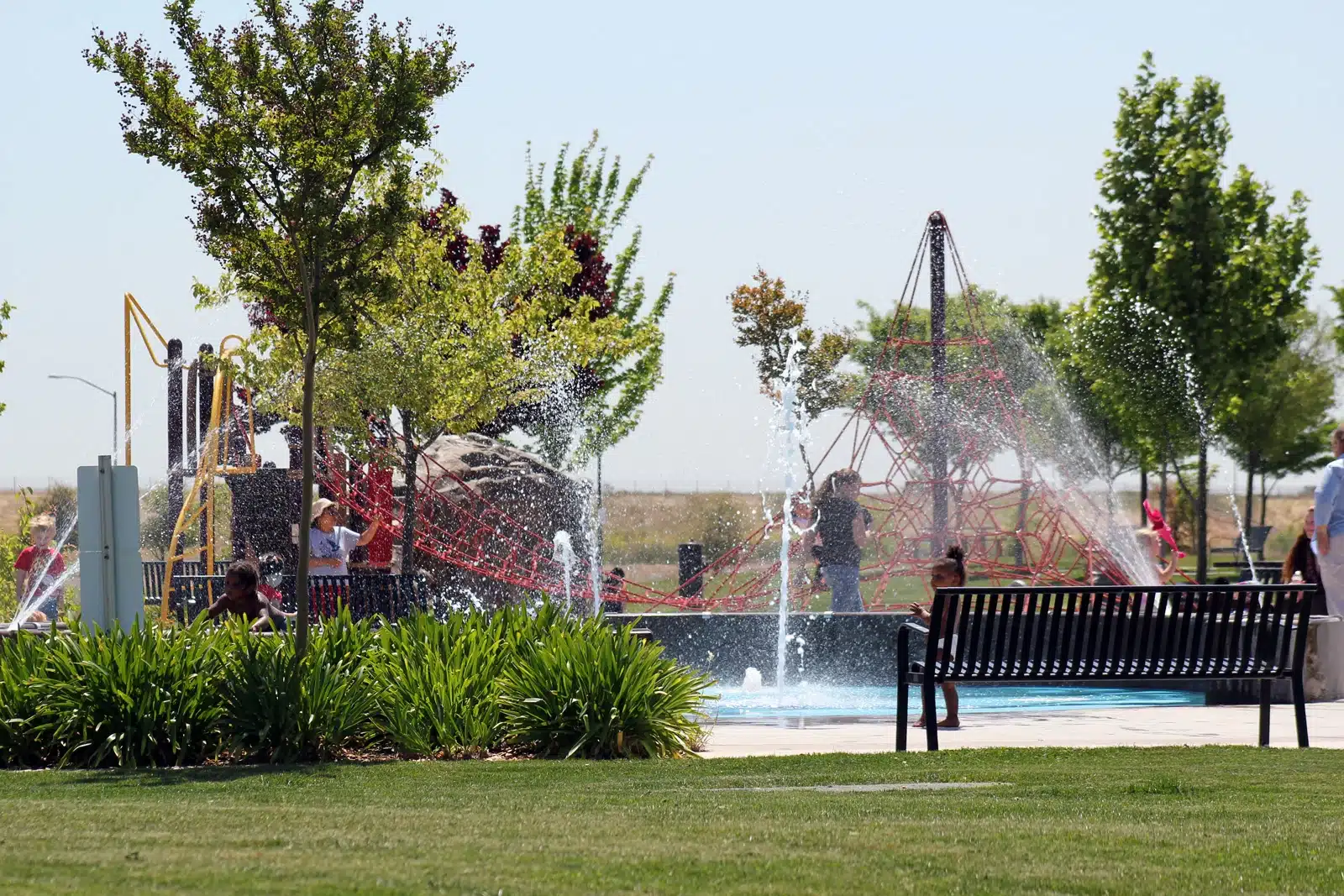 Children playing at splash pad in Stone Creek Community Park, Rancho Cordova, CA