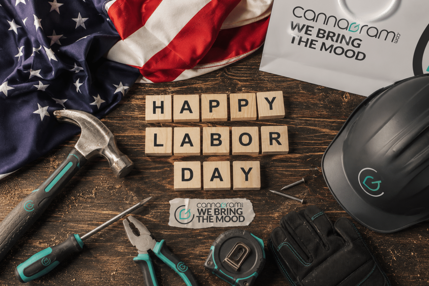 Labor Day tools, American flag and Cannagram branding on a workbench